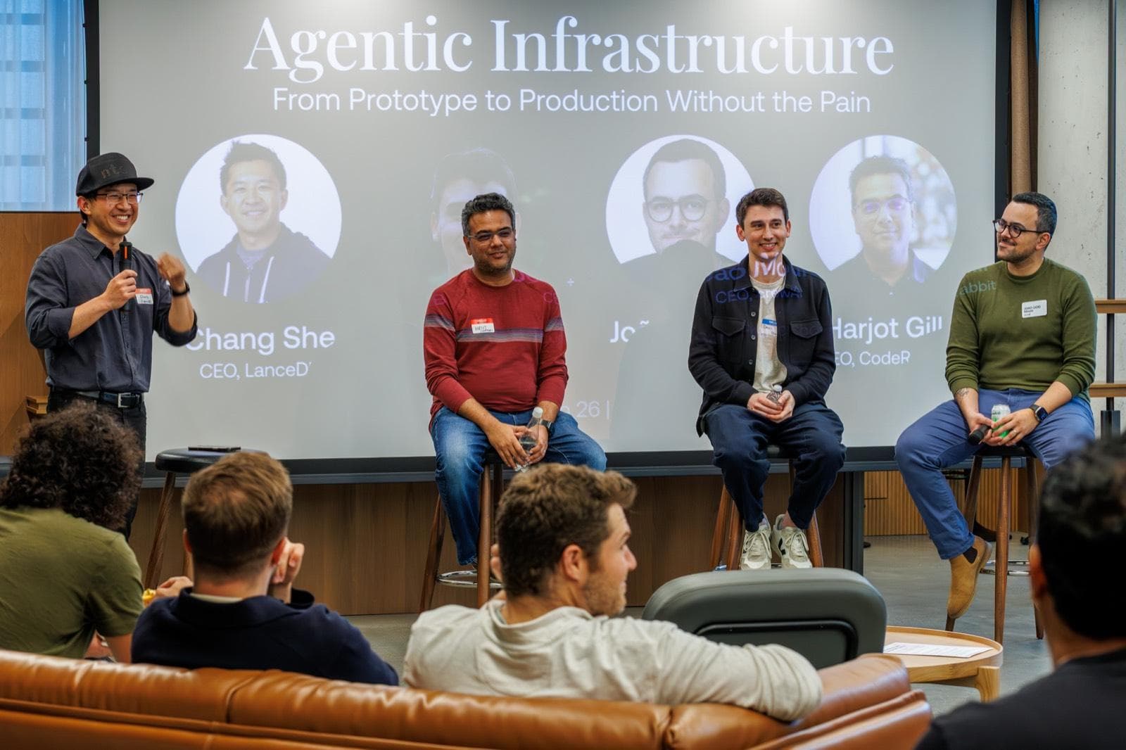 The full panel on stage at the Hanwha AI Center: Chang She (LanceDB), Harjot Gill (CodeRabbit), Devin Stein (Dosu), and João Moura (CrewAI)